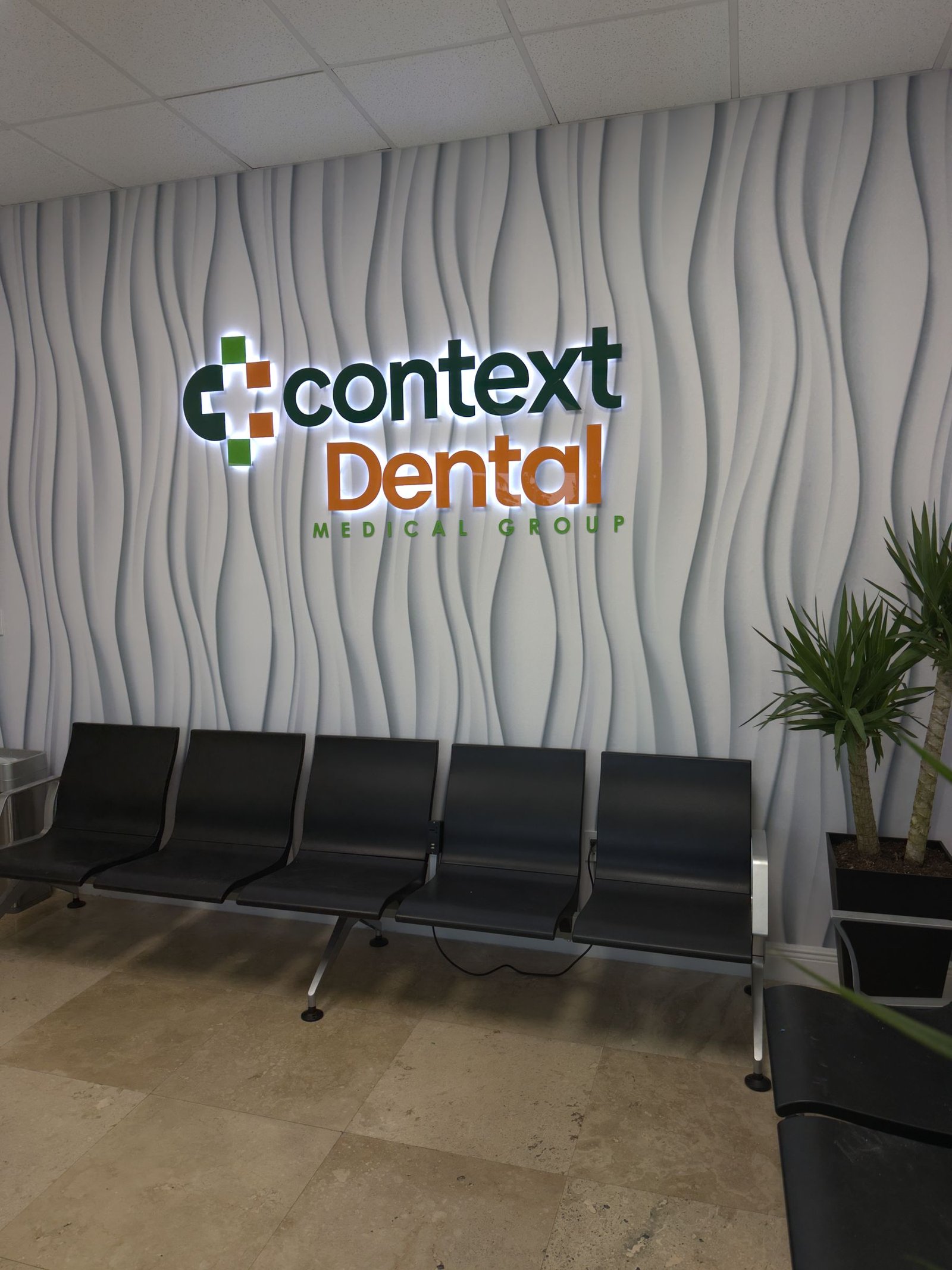 Reception wall sign for Context Dental